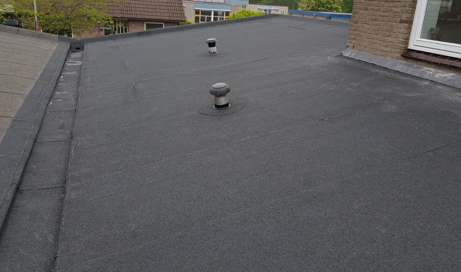 dakbedekking plat dak